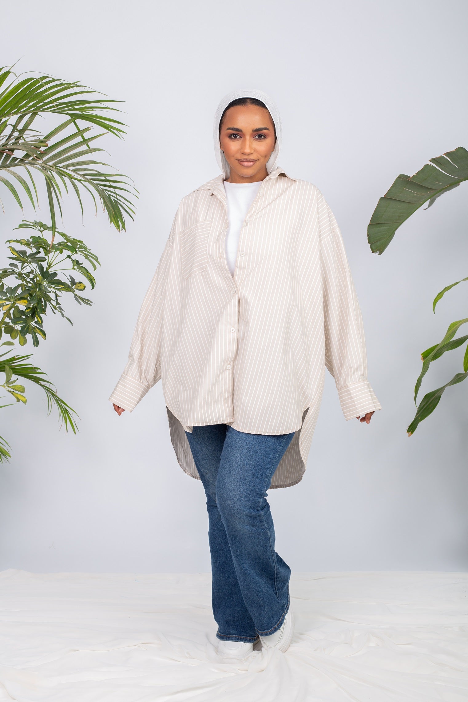 Woman wearing a lined chemise with long sleeves and modest fit