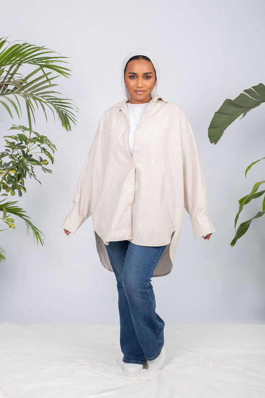 Woman wearing a lined chemise with long sleeves and modest fit