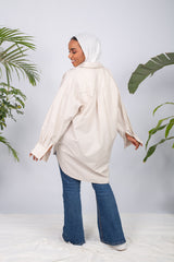 Woman wearing a lined chemise with long sleeves and modest