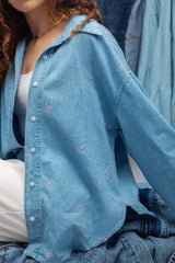 Blue denim shirt with pink bow